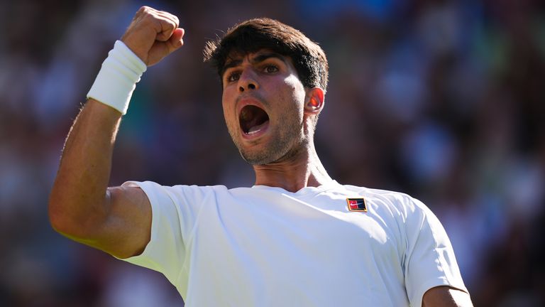 Carlos Alcaraz reacts during his match against Fabio Fognini on day one of the 2025 Wimbledon Championships at the All England Lawn Tennis a
