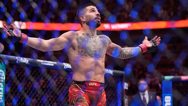 Ilia Topuria celebrates after defeating Charles Oliveira in a lightweight title fight at UFC 317, Saturday, June 28, 2025, in Las Vegas. (AP