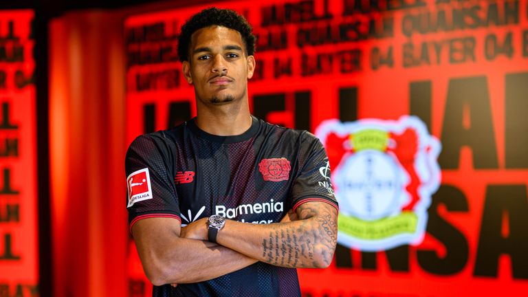 Jarell Quansah poses for a photo after signing for Bayer Leverkusen