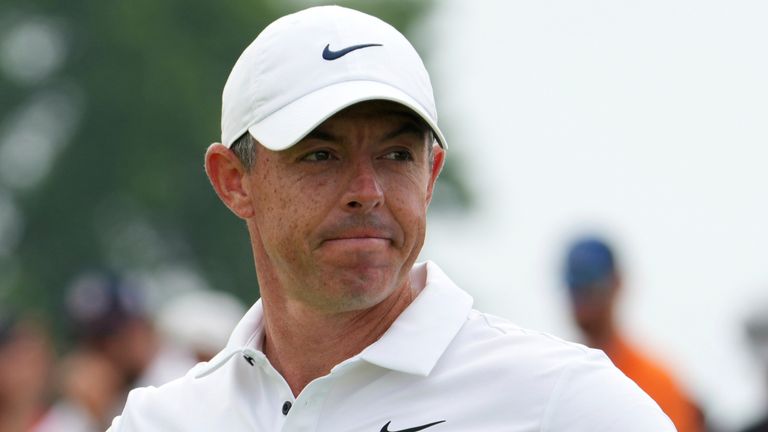 Rory McIlroy, of Northern Ireland, stands on the 11th green after putting in during the final round of the U.S. Open golf tournament at Oakmont Country Club Sunday, June 15, 2025, in Oakmont, Pa. (AP Photo/Gene J. Puskar)
