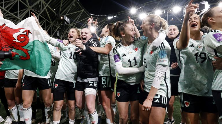 Jess Fishlock celebrates with her teammates after Wales reached Euro 2025